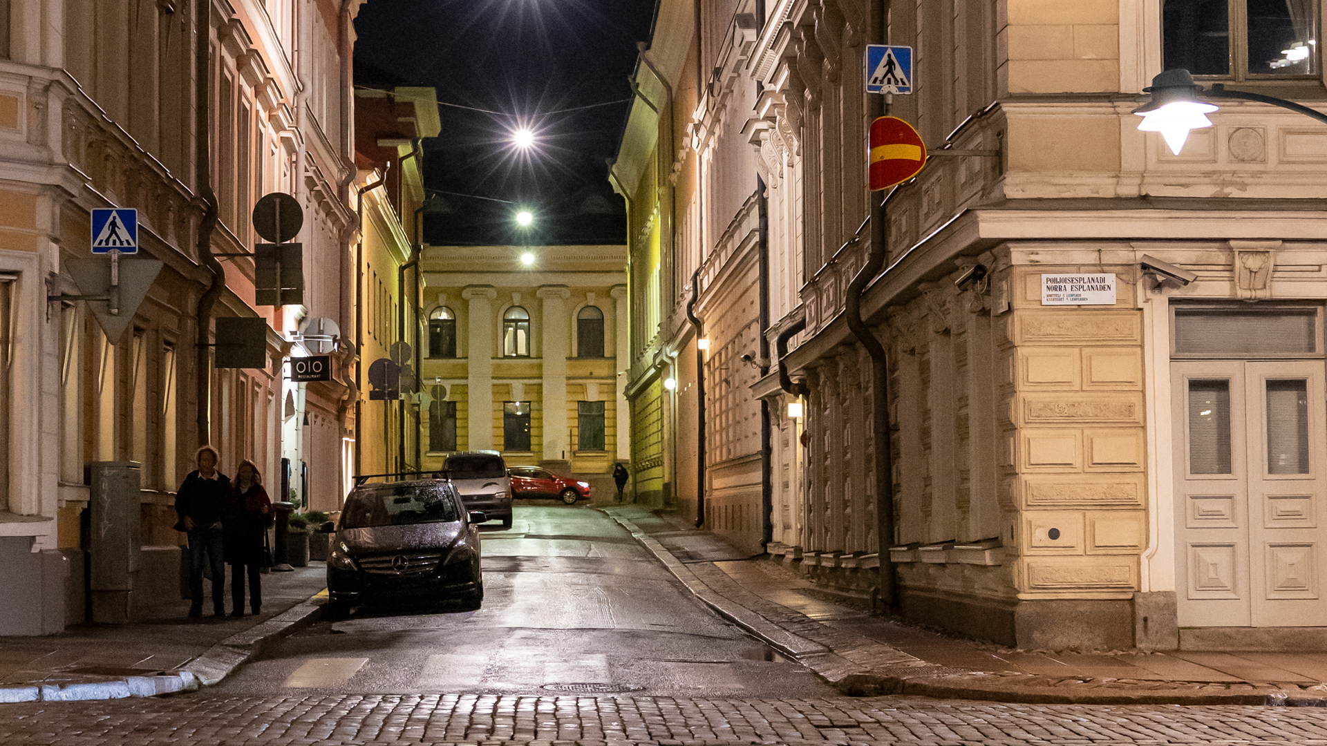 Dark night in Helsinki with street lights.