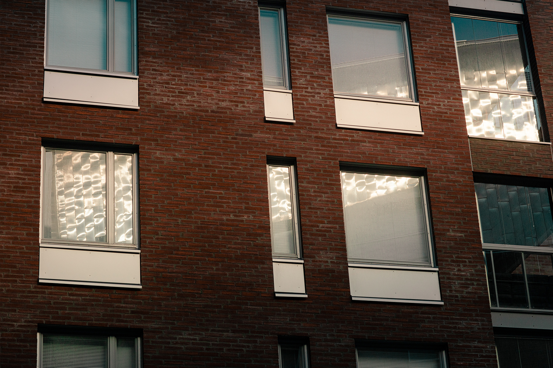 Illustration sunlight reflecting on windows of a brown building. 